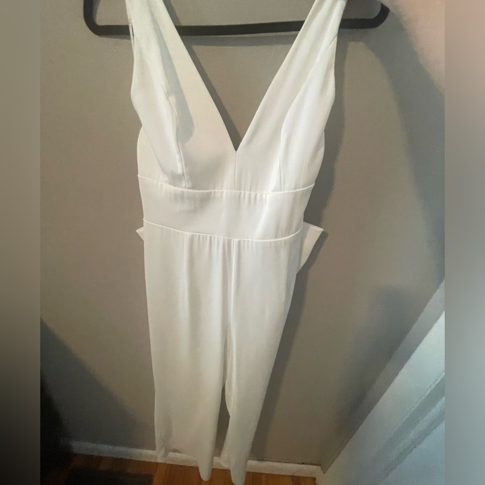 Lulu’s jumpsuit with detachable bow